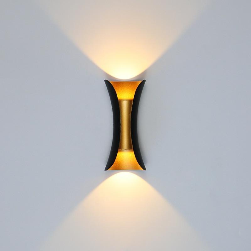Outdoor wall lamp featuring a sleek curved design, dual LED emission, and a weather-resistant IP65 rating, ideal for enhancing exterior lighting in gardens and patios 0